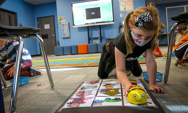 Girl uses BeeBot